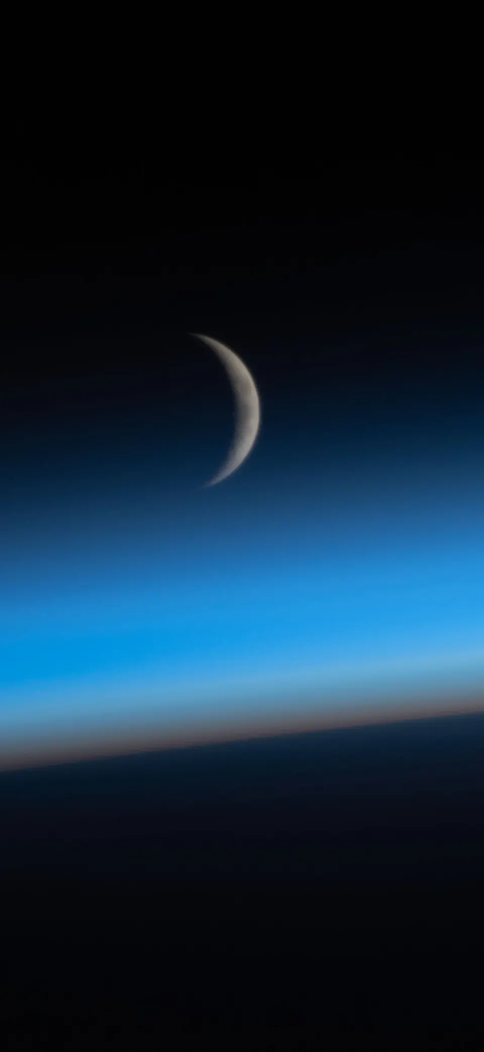 Crescent Moon above the atmosphere iPhone wallpaper