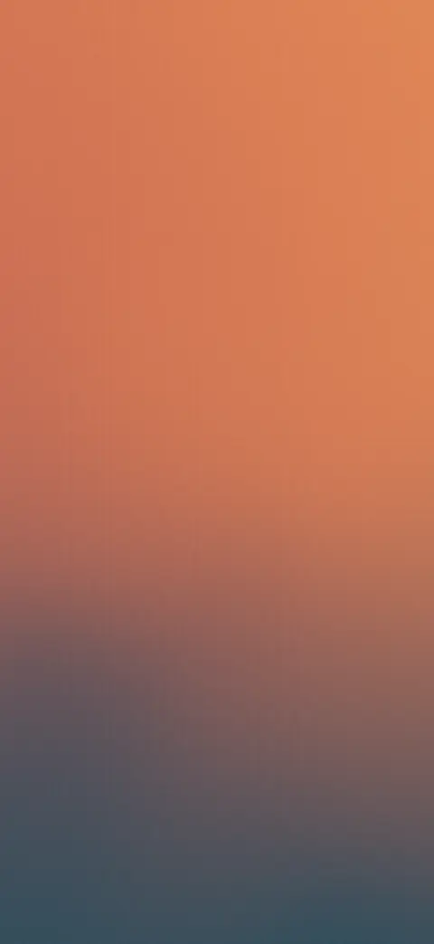 Rust and teal grain gradient iPhone wallpaper